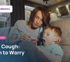 Young child coughing into their elbow at home, guide to when a child's cough needs a pediatrician