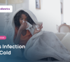 Child with a stuffy nose blowing into a tissue, how to tell a sinus infection from a common cold in kids
